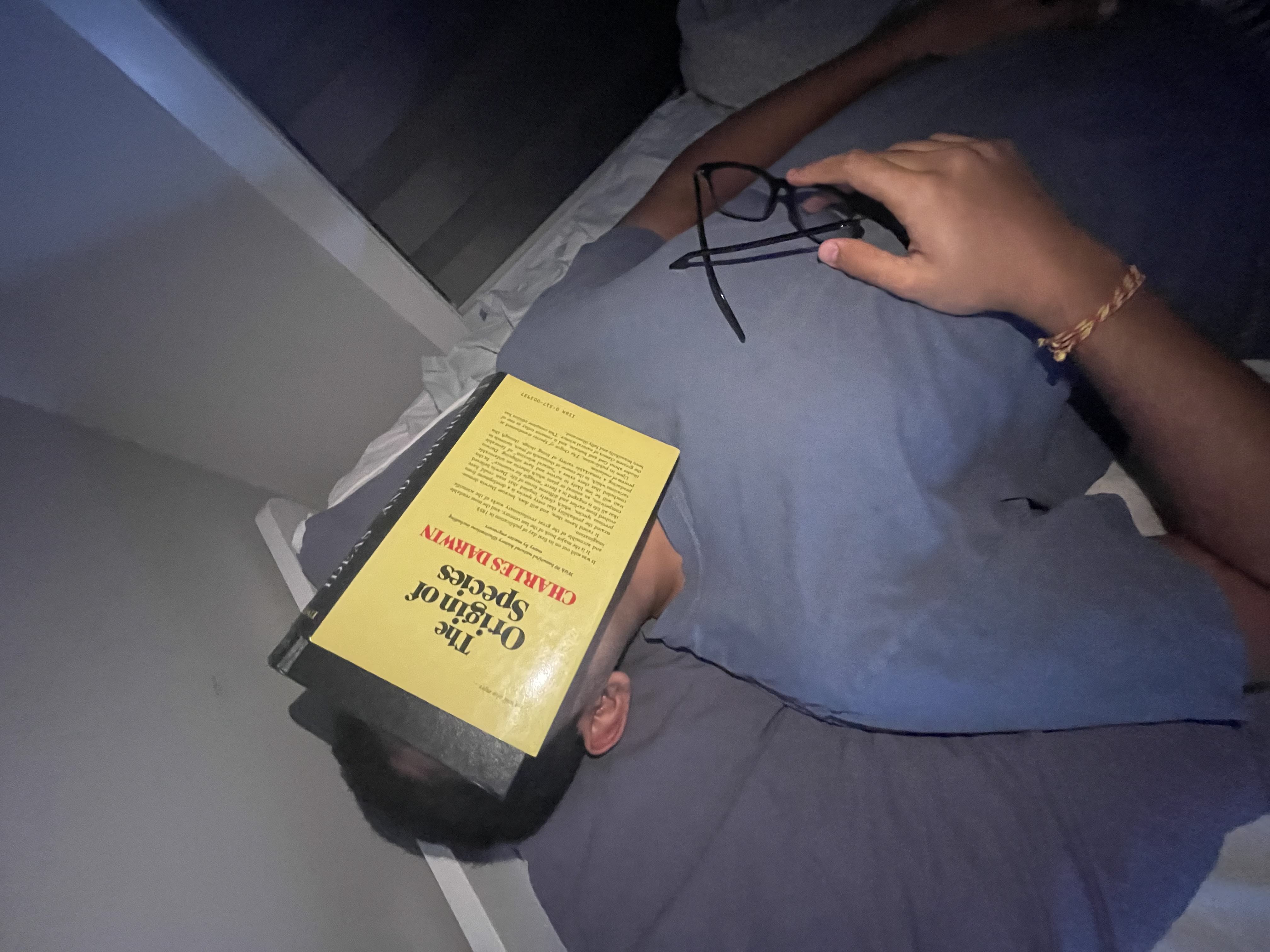 Neil sleeping with a book